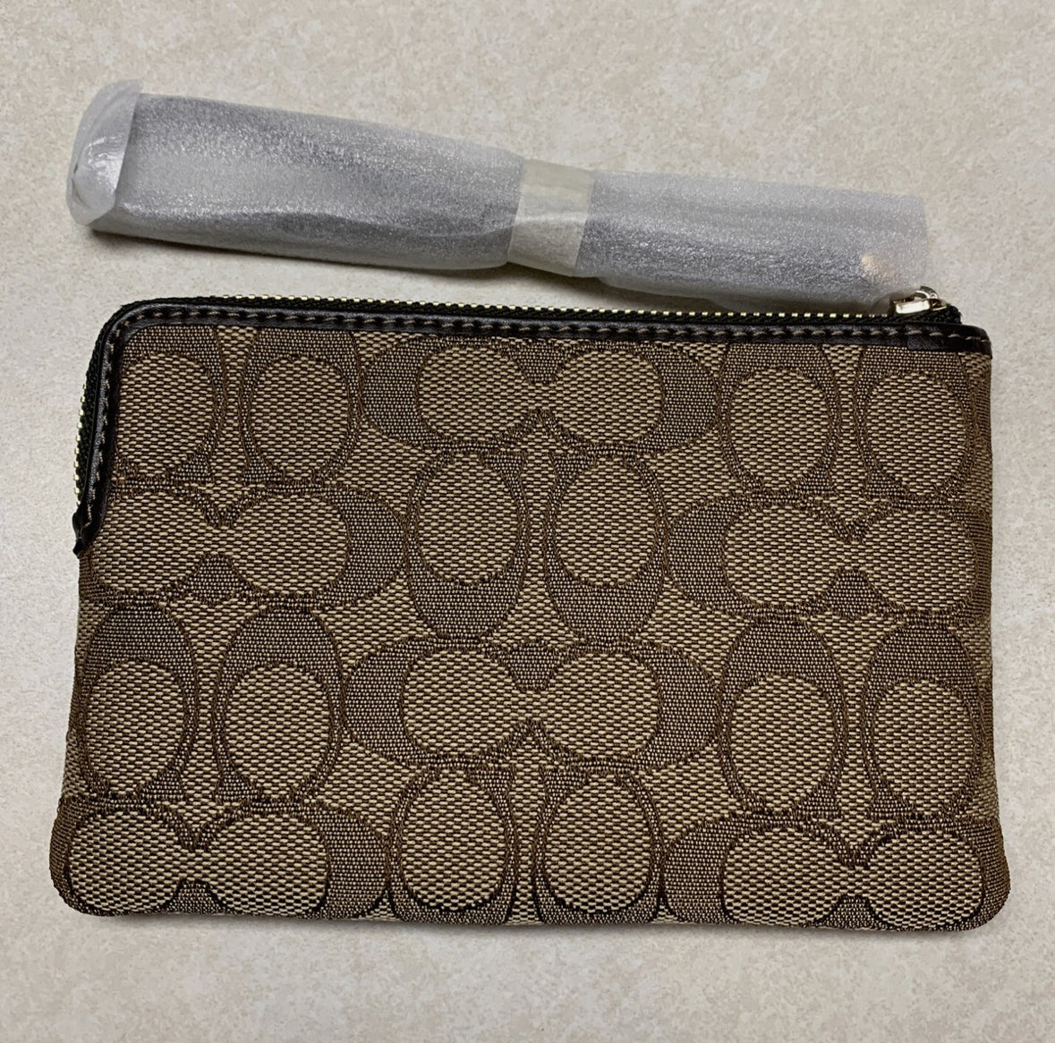 Pulsera COACH Corner con cremallera